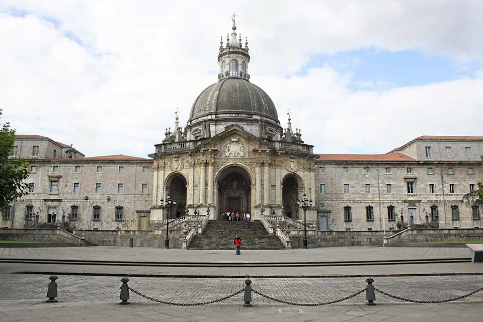 Exterior of the Sanctuary of Loyola, a Baroque style building with a en elaborate dome in the middle.