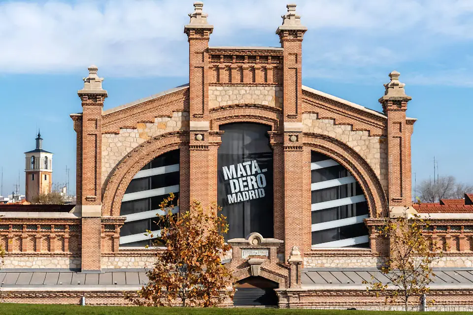 Exterior image of Matadero Madrid, a facade with neo-Mujadar features, such as brick and tile.