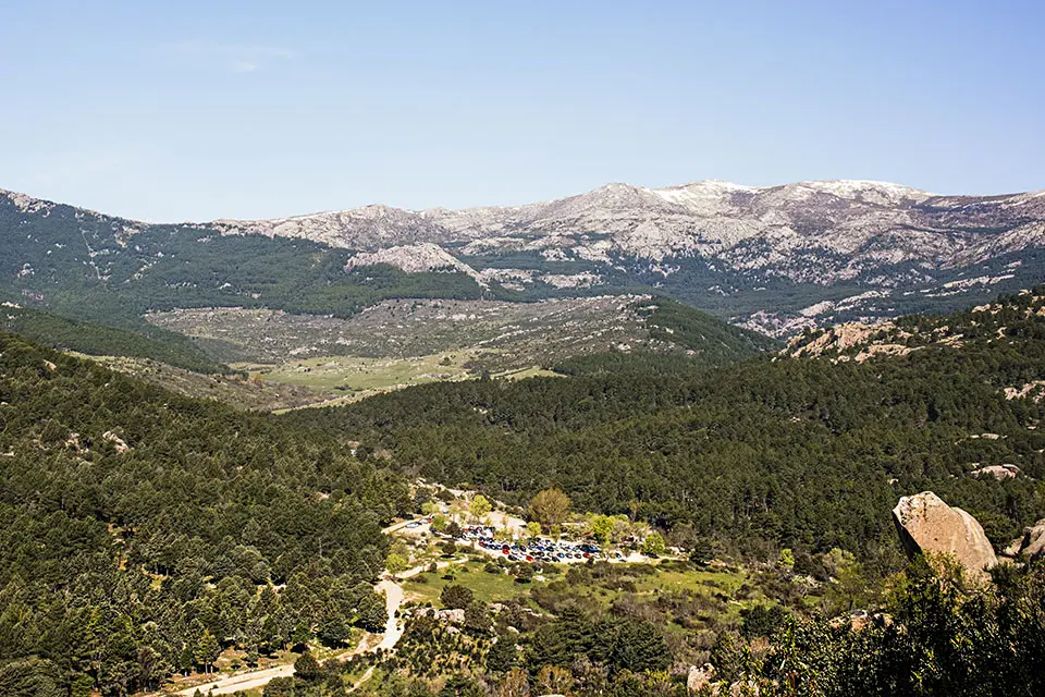 Image of a mountain vista looking out over a small village.