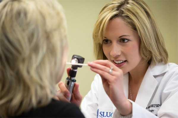 SLUCare doctor examining a patient 