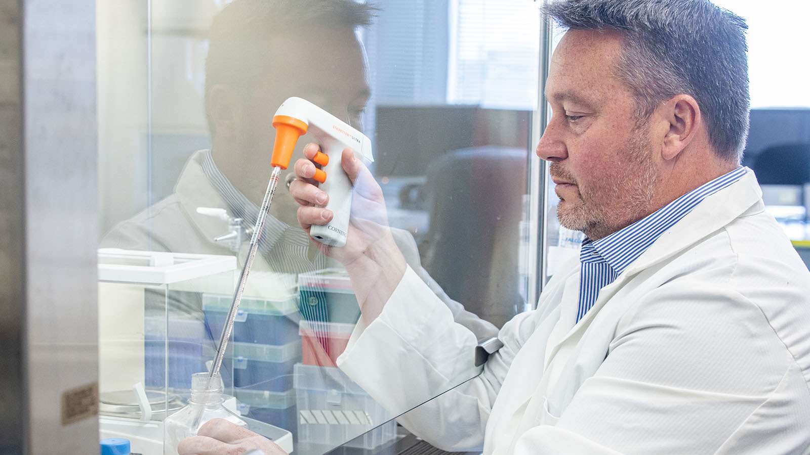 Richard DiPaolo works with lab instruments.
