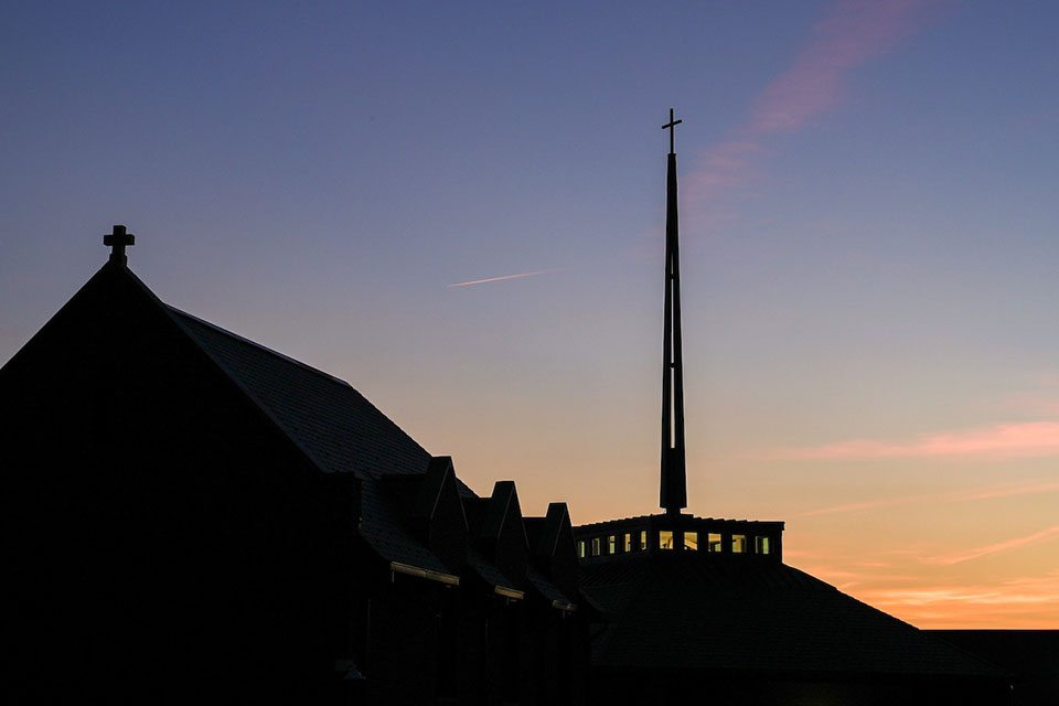 Exterior of SLU Jesuit Center at sunset