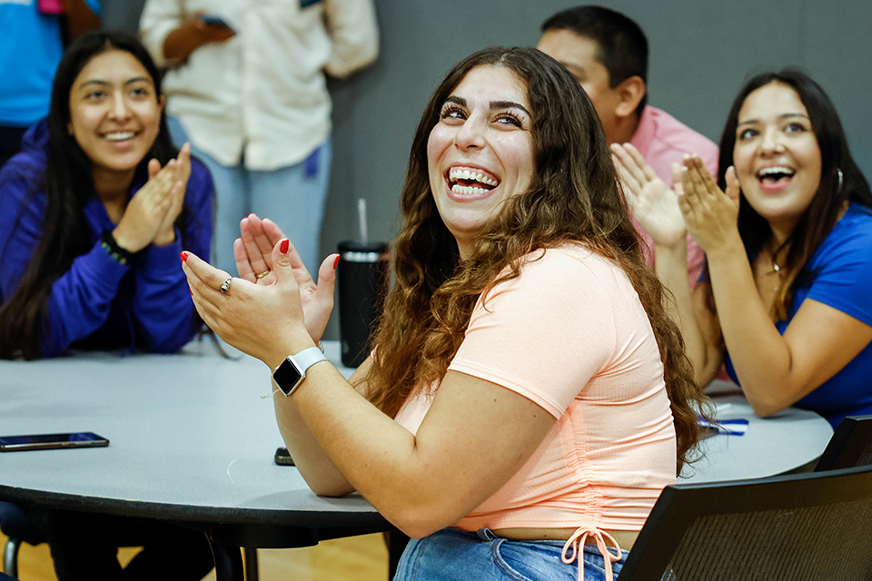 A team celebrates their trivia win during the Hispanic Heritage Month kickoff at SLU's Center for Global Citizenship on Sept. 15, 2022.