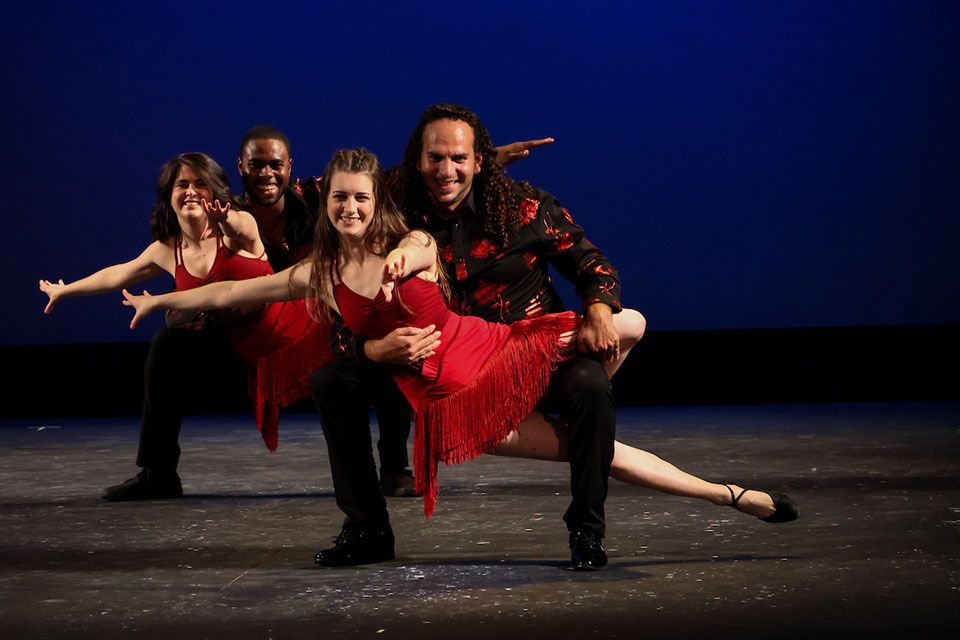 Sazón dancers perform. 