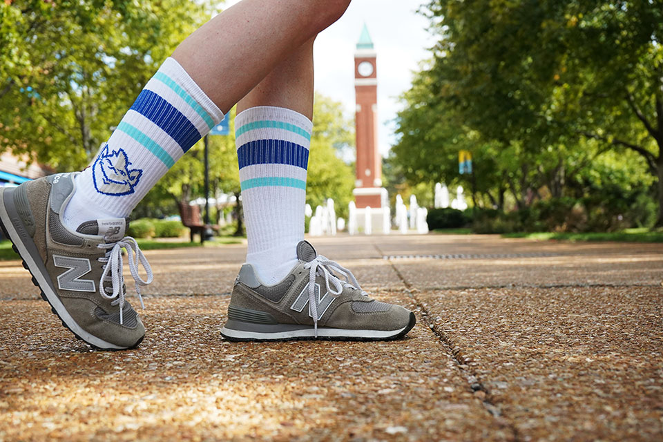 Billiken socks in front of the Clock Tower plaza. 