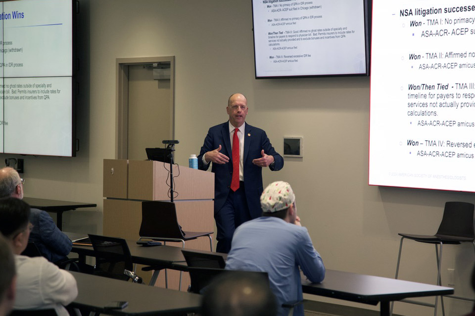 Don Arnold, M.D., addresses the crowd during a recent grand rounds. 