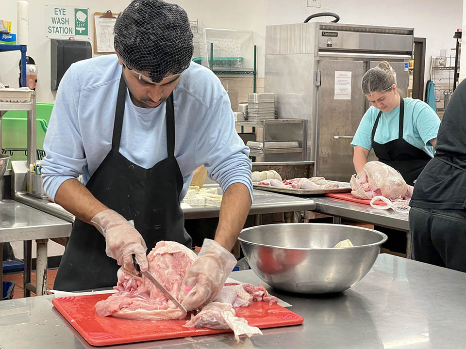 SLU students prepare turkeys at Campus Kitchen. Photo by Carrie Bebermeyer.