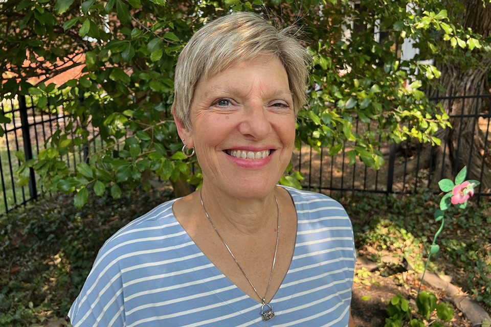 Denise Côté-Arsenault, Ph.D., poses for a photo outdoors in her backyard.