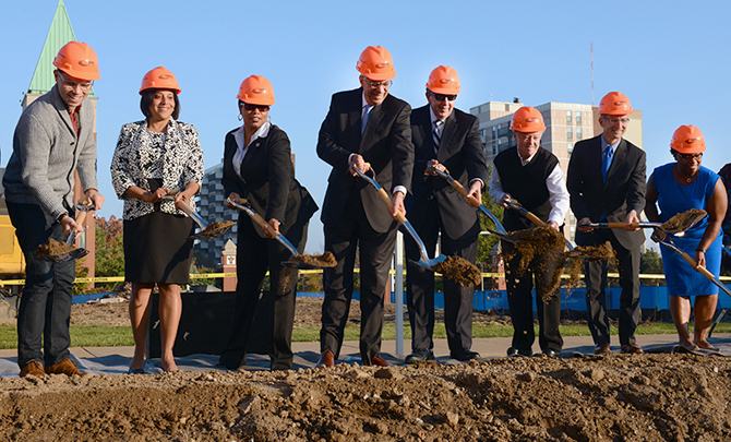 Participants break ground at the site.