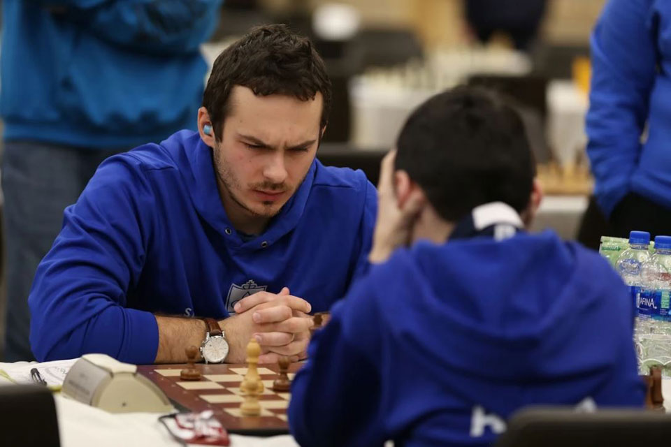 SLU chess player Oleksandr Ipatov contemplates a move.