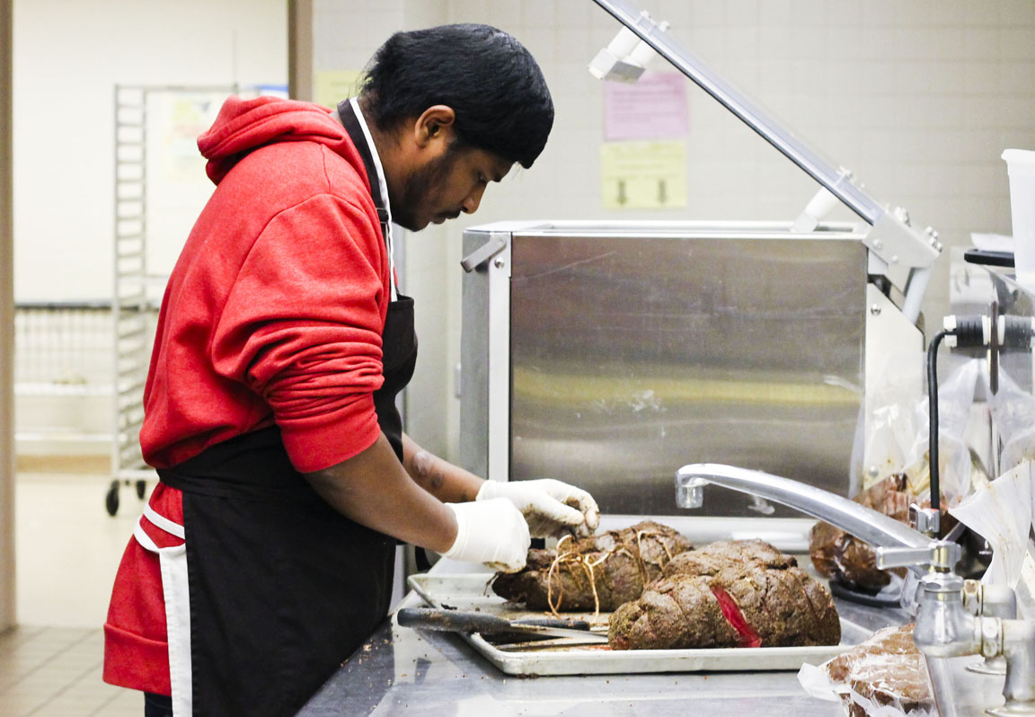 Nithil Bollock prepares meals for elementary and middle schools