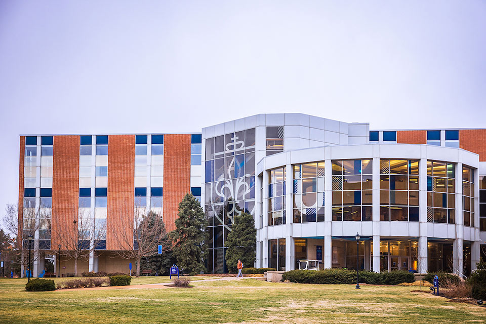 Exterior of Pius XII Memorial Library, a multi-story red brick building and large windows