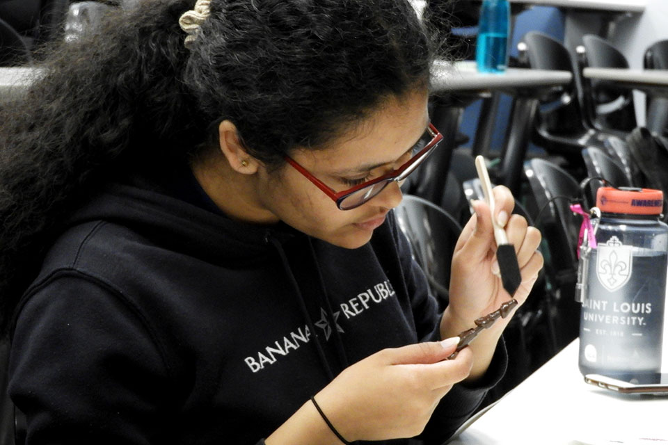 A student readies her wand