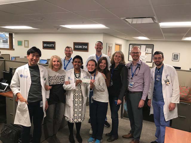 Back row (left to right):  Josh Mayer, DO and Alex Finn, NP  Front row (left to right):  Taka Ishiyama, MD, Mary Streif, Farzana Hoque, Campus Kitchen team and Melissa Aprill, Matthew Hyde, NP and Ilya Bunimovich, PA-C.