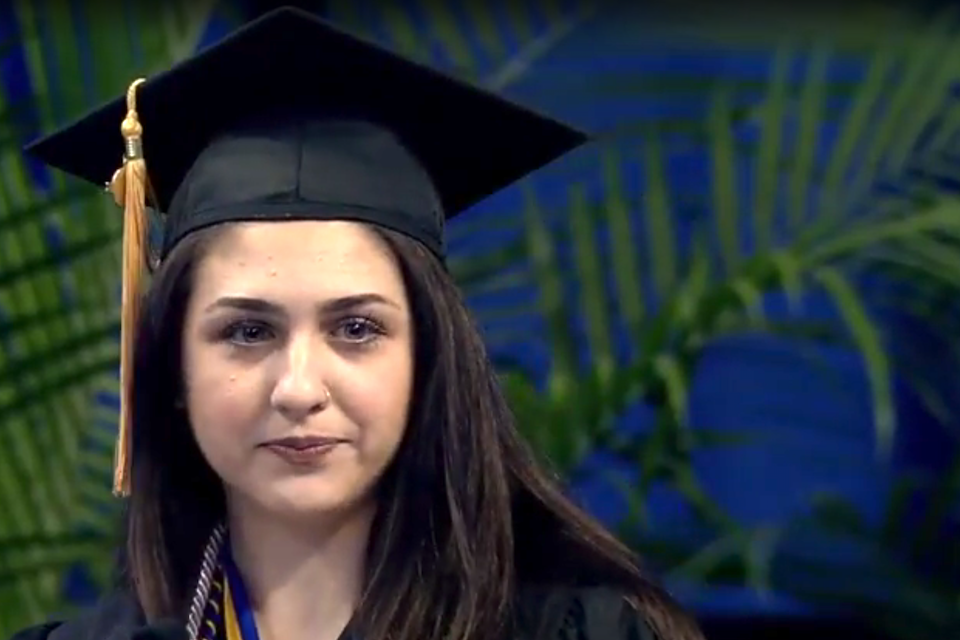 Caroline Kebbe, Master of Social Work graduate, gives one of the 2018 Precommencement speeches.