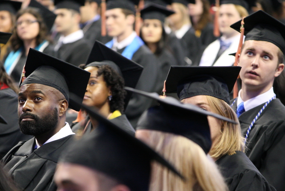 Students in cap and gown at the College's Pre-Commencement ceremony 