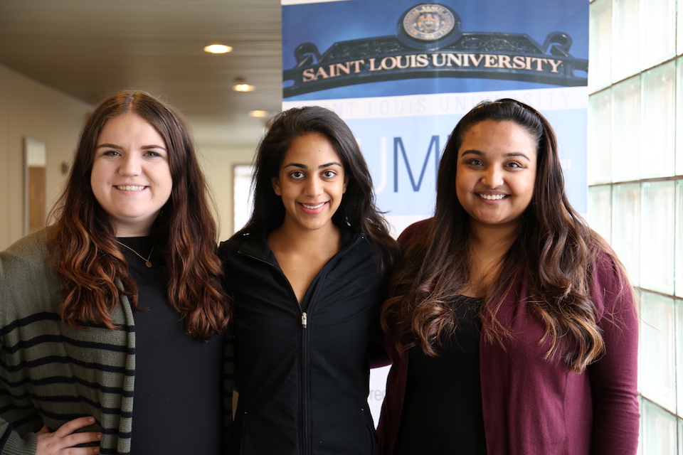 The three co-chairs of the Women In Leadership group stand together.