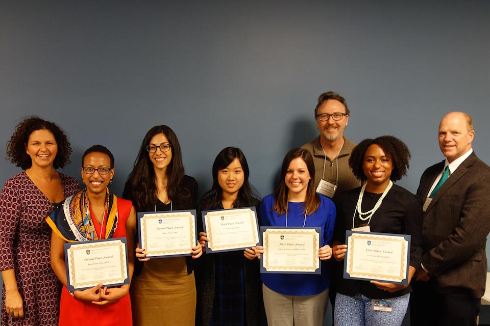 Winners of the reserach symposium pose with their certificates.