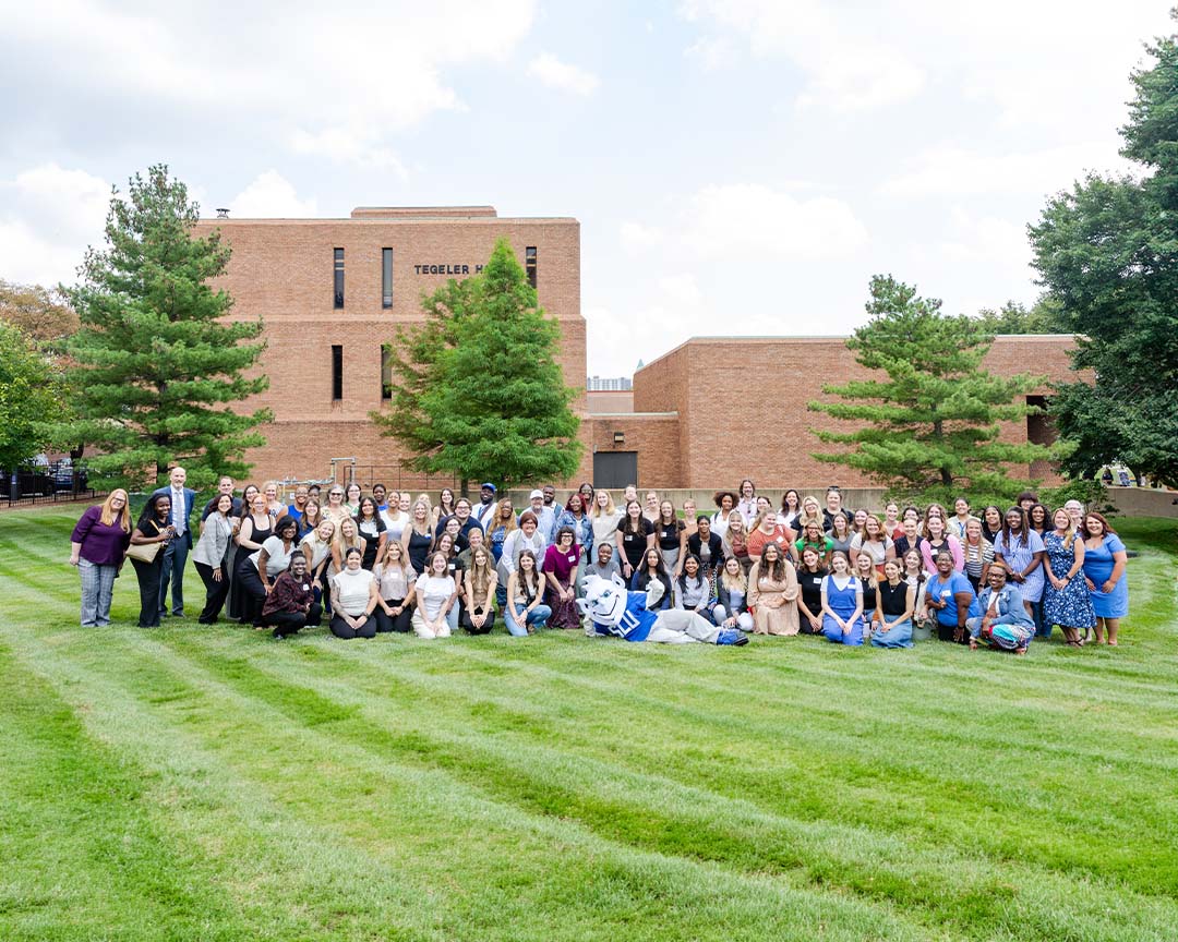 School of Social Work staff and faculty outside with Billiken