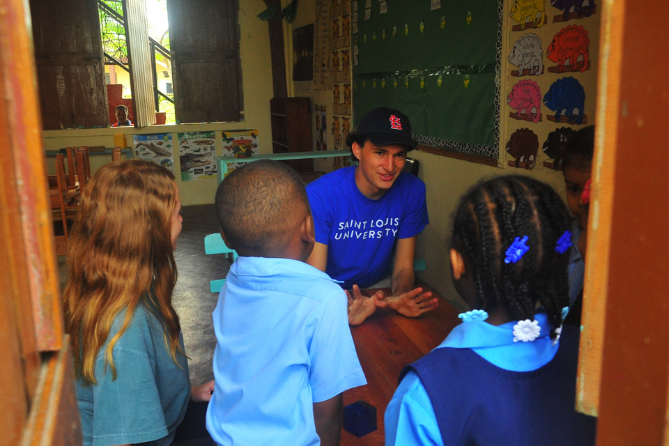 SLU student teaching students at school in Belize