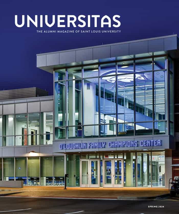 The cover of the 2024 summer issue of Universitas magazine, with an image of the exterior of the O'Laughlin Family Champions Center under a night sky. The building has two stories with tall vertical windows..